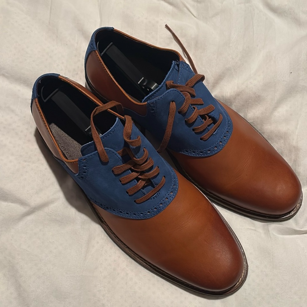 Cole Haan dress shoes including the original box and shoe covers.